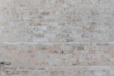 Gri taş duvara İspanya. Taş dokusu. Farklı şekiller taşlarla