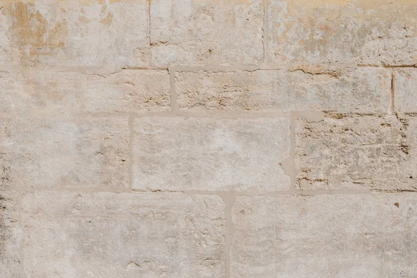 İspanya eski sarı çizilmiş tuğla duvar. Doku tuğla 