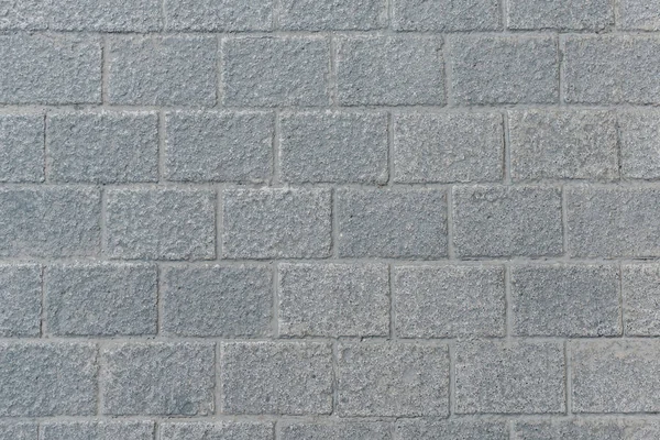 Eski gri çizilmiş yol döşeme İspanya'da duvar. Beton tuğla dokusu