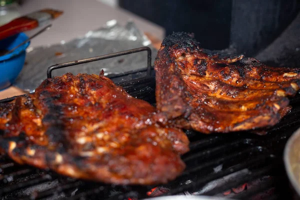 Grilled pork ribs, delicious grilled ribs, home barbecue - cooking grilled meat