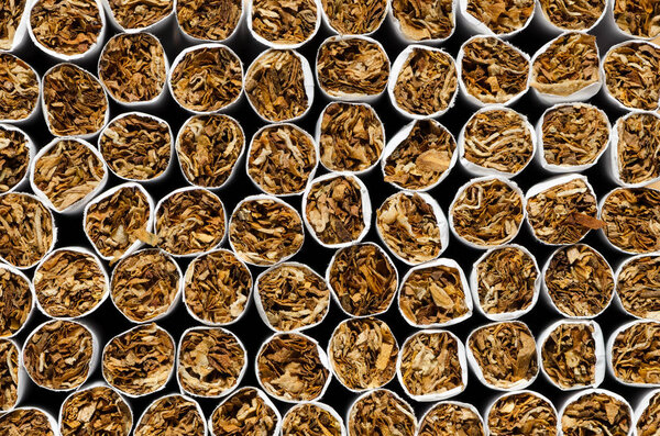 Heap of Tobacco Cigarettes Top View close up Stack background texture