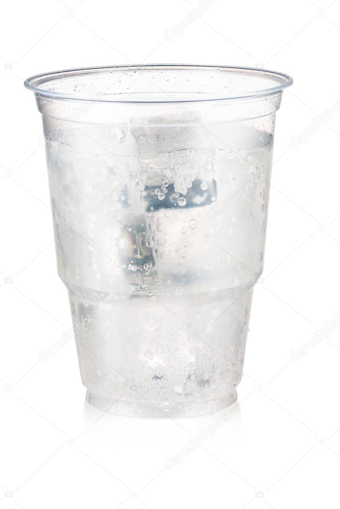 Soda carbonated drink with ice in a plastic cup isolated on whit