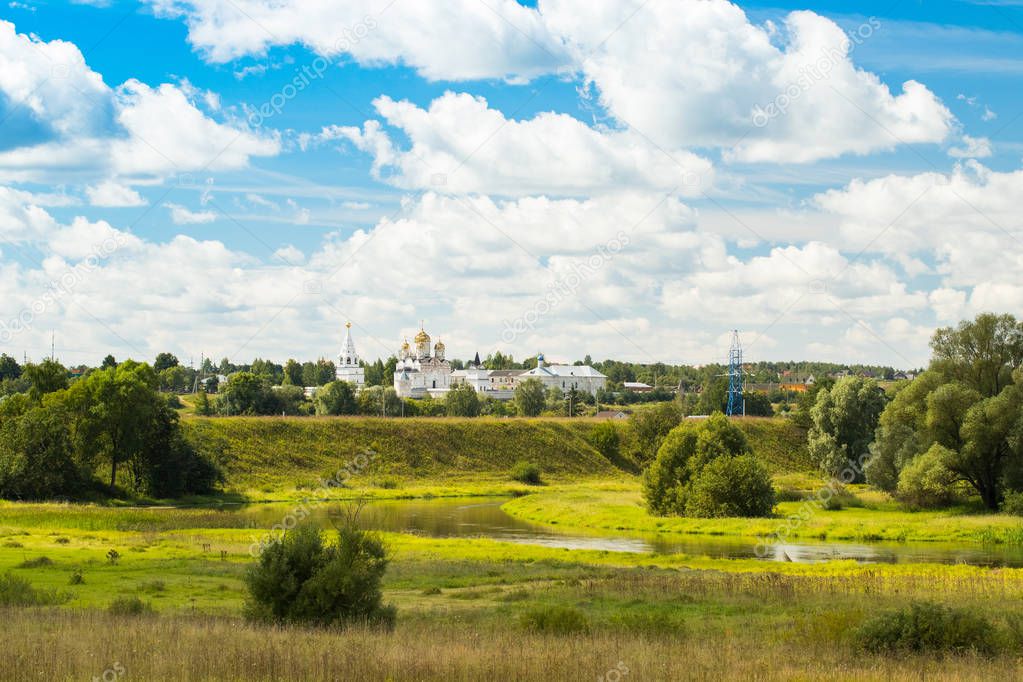 Mozhaysk, Russia. Beautiful Scenic landscape Of Luzhetsky Monastery Under Dramatic Sky In Sunny Day In Summer.
