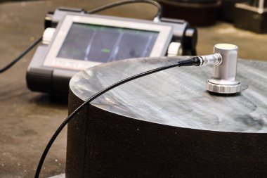 Ultrasonic flaw detector krautkramer USM 36 at the plant during  clipart
