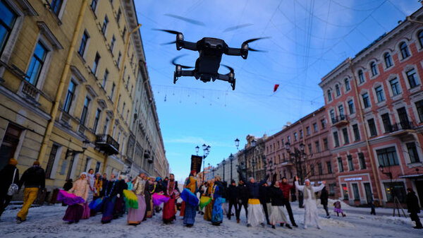 Drone flies low in the center of the city and leads photo and vi