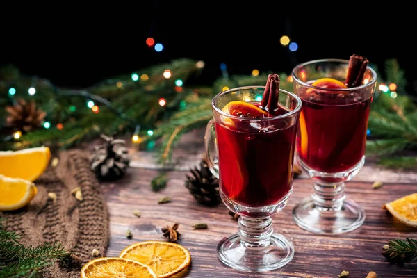 Christmas mulled wine with orange, spices on a wooden table — Stock Photo, Image