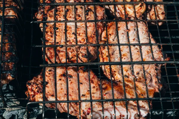 Pork meat is fried on the grill for barbecue — Stock Photo, Image