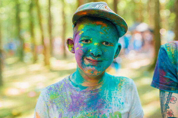 VICHUGA, RUSSIA - JUNE 17, 2018: Festival of colors Holi. Portrait of a happy boy