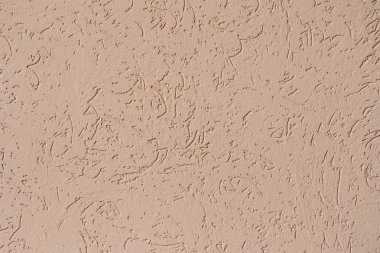 bej dokulu macun ile kaplı duvar yapısı