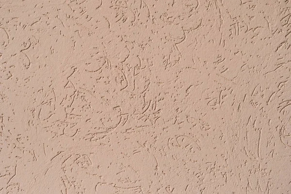 Struktur der Wand mit beige strukturiertem Kitt bedeckt — Stockfoto