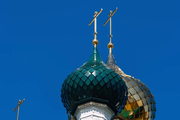 Golden and green domes with crosses of the Russian Orthodox Church