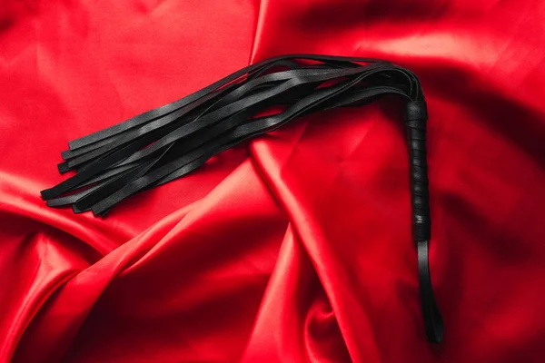 Leather black whip for sex games in bdsm sex — Stock Photo, Image