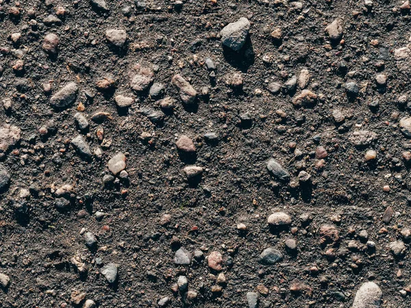 Texture of dirty old asphalt with stones — Stock Photo, Image