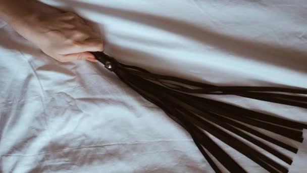 Sexy Young Girl Lingerie Sensually Holds Leather Whip Flogger Bed — Stock Video