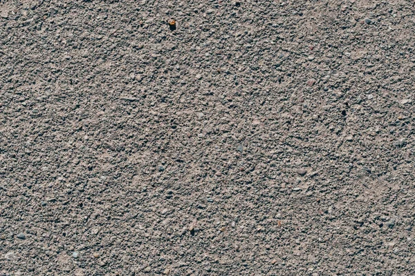 stock image texture of dirty old asphalt with stones