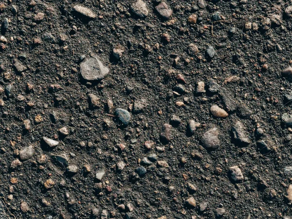 Texture of dirty old asphalt with stones — Stock Photo, Image