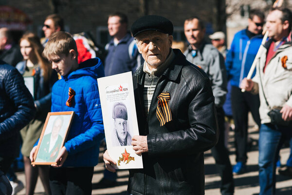 VICHUGA, RUSSIA - MAY 9, 2018: Portrait of man on a March in honor of the victory in world war II