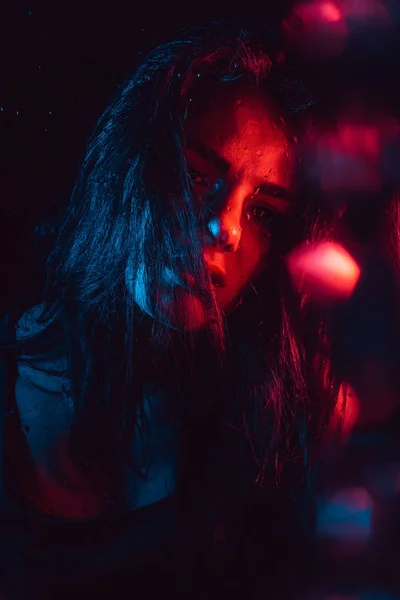 Sensual portrait of sad melancholic lonely girl behind glass with raindrops — Stock Photo, Image