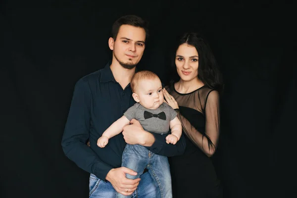 Happy white Caucasian family. Mom and dad with baby infant boy in hands — Stock Photo, Image