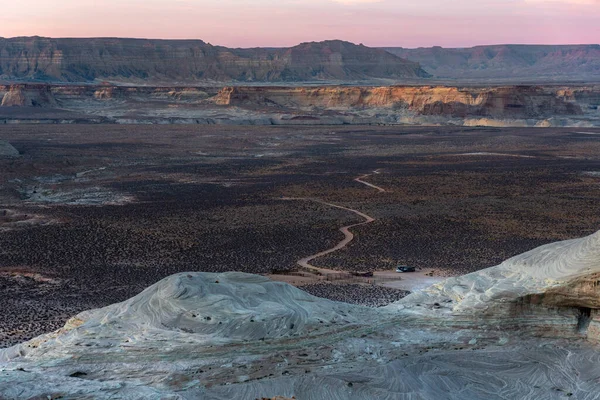 Flat Arid Landscape with Distant Caravan from Stud Horse Point, Page, Arizona, USA. High quality photo