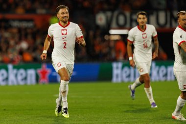 Matty Cash, Hollanda ve Polonya milli takımları arasında oynanan Dünya Kupası 2026 Avrupa ön eleme maçında gol attıktan sonra kutlama yaparken görüldü (Maciej Rogowski / Ball Raw Images)