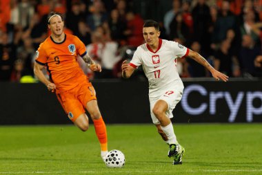 Wout Weghorst ve Bartosz Slisz, Hollanda ve Polonya milli takımları arasında oynanan Dünya Kupası 2026 Avrupa ön eleme maçında görüldü (Maciej Rogowski / Ball Raw Images)