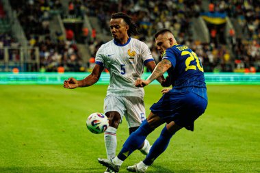 Jules Kounde ve Oleksandr Zubkov, Ukrayna ve Fransa milli takımları arasında oynanan 2026 Dünya Kupası ön eleme maçında görüldü (Maciej Rogowski / Ball Raw Images)