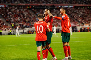 Bernardo Silva, Cristiano Ronaldo and Joao Cancelo seen celebrating after goal  during World Cup 2026 European qualification game between national teams of Hungary and Poland (Maciej Rogowski/ Ball Raw Images)