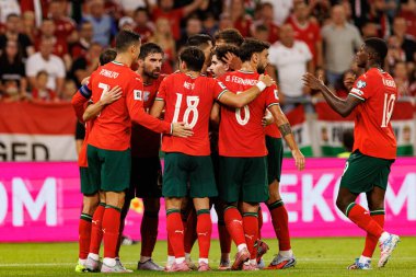 Players of Portugal seen  celebrating after goal from Bernardo Silva during World Cup 2026 European qualification game between national teams of Hungary and Poland (Maciej Rogowski/ Ball Raw Images)