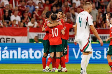 Players of Portugal seen  celebrating after goal from Bernardo Silva during World Cup 2026 European qualification game between national teams of Hungary and Poland (Maciej Rogowski/ Ball Raw Images)