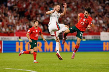 Barnabas Varga and Vitinha seen  during World Cup 2026 European qualification game between national teams of Hungary and Poland (Maciej Rogowski/ Ball Raw Images)