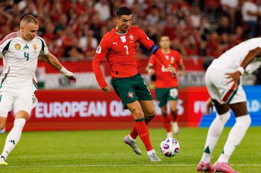 Attila Szalai and Cristiano Ronaldo seen  during World Cup 2026 European qualification game between national teams of Hungary and Poland (Maciej Rogowski/ Ball Raw Images)