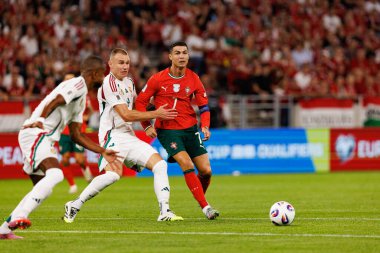 Attila Szalai and Cristiano Ronaldo seen  during World Cup 2026 European qualification game between national teams of Hungary and Poland (Maciej Rogowski/ Ball Raw Images)