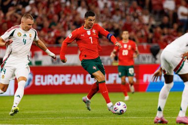Attila Szalai and Cristiano Ronaldo seen  during World Cup 2026 European qualification game between national teams of Hungary and Poland (Maciej Rogowski/ Ball Raw Images)