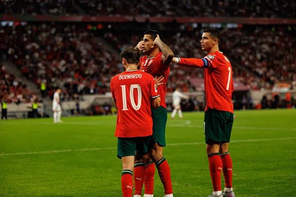 Bernardo Silva, Cristiano Ronaldo and Joao Cancelo seen celebrating after goal  during World Cup 2026 European qualification game between national teams of Hungary and Poland (Maciej Rogowski/ Ball Raw Images)