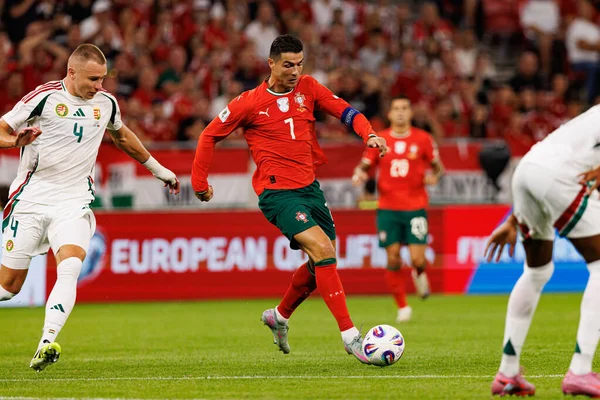 Attila Szalai and Cristiano Ronaldo seen  during World Cup 2026 European qualification game between national teams of Hungary and Poland (Maciej Rogowski/ Ball Raw Images)