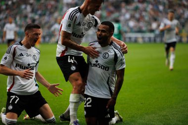  Juergen Elitim, Damian szymanski and Ermal Krasniqi seen celebrating after scoring goal during PKO BP Ekstraklasa 25 26 game between teams of Legia Warszawa and Radomiak Radom at Wojska Polskiego Stadium (Maciej Rogowski/Ball Raw Images)