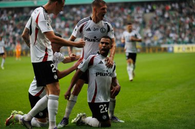  Juergen Elitim, Damian Szymanski, Mileta Rajovic seen celebrating after scoring goal during PKO BP Ekstraklasa 25 26 game between teams of Legia Warszawa and Radomiak Radom at Wojska Polskiego Stadium (Maciej Rogowski/Ball Raw Images)