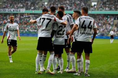  Damian Szymanski, Juergen Elitim, Ermal Krasniqi and others seen celebrating after scoring goal during PKO BP Ekstraklasa 25 26 game between teams of Legia Warszawa and Radomiak Radom at Wojska Polskiego Stadium (Maciej Rogowski/Ball Raw Images)