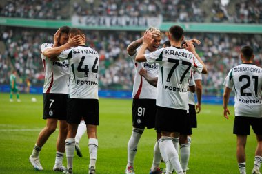 Ermal Krasniqi, Damian Szymanski, Kamil Piatkowski and Pawel Wszolek seen celebrating after scoring goal during PKO BP Ekstraklasa 25 26 game between teams of Legia Warszawa and Radomiak Radom at Wojska Polskiego Stadium (Maciej Rogowski/Ball Raw Ima