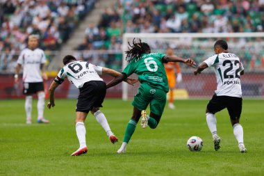 Romario Baro, Bartosz Kapustka and Juergen Elitim seen during PKO BP Ekstraklasa 25 26 game between teams of Legia Warszawa and Radomiak Radom at Wojska Polskiego Stadium (Maciej Rogowski/Ball Raw Images)