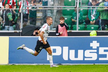 Damian Szymanski seen celebrating after scoring goal during PKO BP Ekstraklasa 25 26 game between teams of Legia Warszawa and Radomiak Radom at Wojska Polskiego Stadium (Maciej Rogowski/Ball Raw Images)