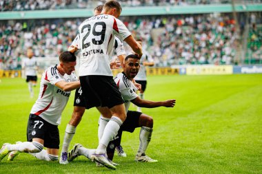 Mileta Rajovic and Juergen Elitim seen celebrating after scoring goal during PKO BP Ekstraklasa 25 26 game between teams of Legia Warszawa and Radomiak Radom at Wojska Polskiego Stadium (Maciej Rogowski/Ball Raw Images)