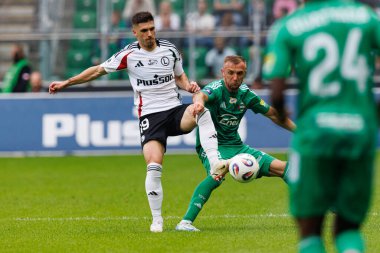 Ruben Vinagre and Jan Grzesik seen during PKO BP Ekstraklasa 25 26 game between teams of Legia Warszawa and Radomiak Radom at Wojska Polskiego Stadium (Maciej Rogowski/Ball Raw Images)