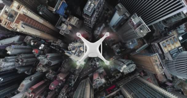 AERIAL. Top view of Drone delivers the goods against the background of Hong Kong city. — Stock Video