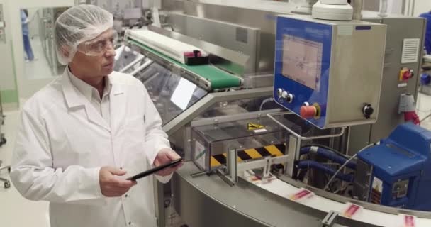 Confident Adult Worker Using Digital Tablet While Taking Inventory Pharmaceutical — Stock Video