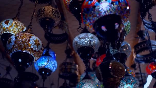 Camera moving throught traditional turkish lamps at night time — Stock Video