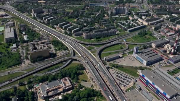 AERIAL. Amazing topview of two-level road junction in Russia. Day traffic of expressways. Saint - Petersburg — Stock Video