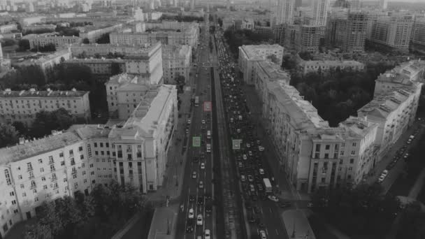 Aerial view of black white modern european city with a large road. Camera tracking concept — Stock Video