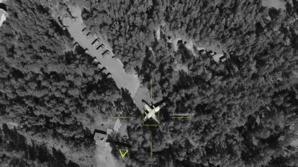 Top view of a spy war drone watching and aiming at a hidden military base — Stock Video